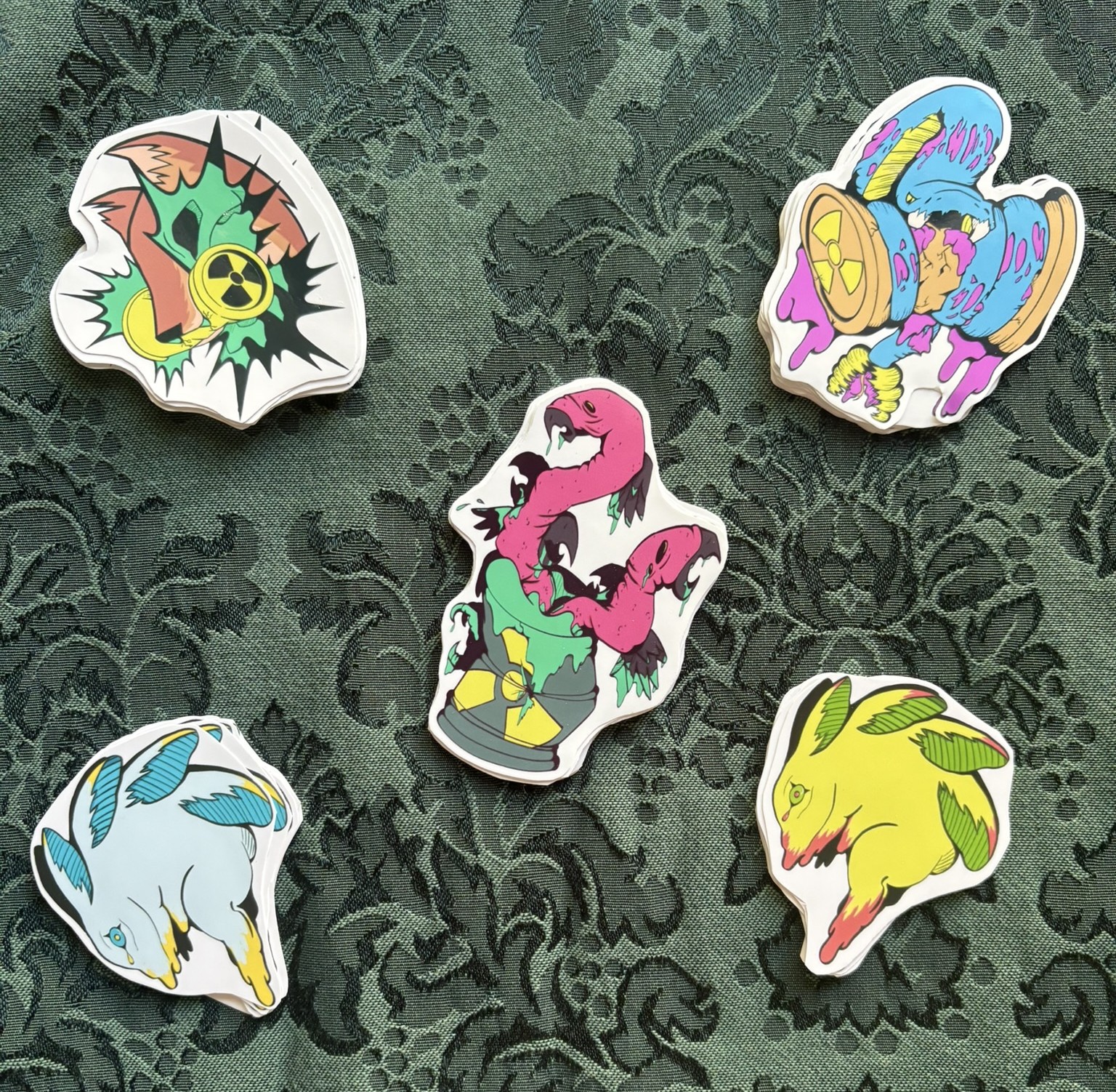 Picture of 5 different stickers depicting mutated animals