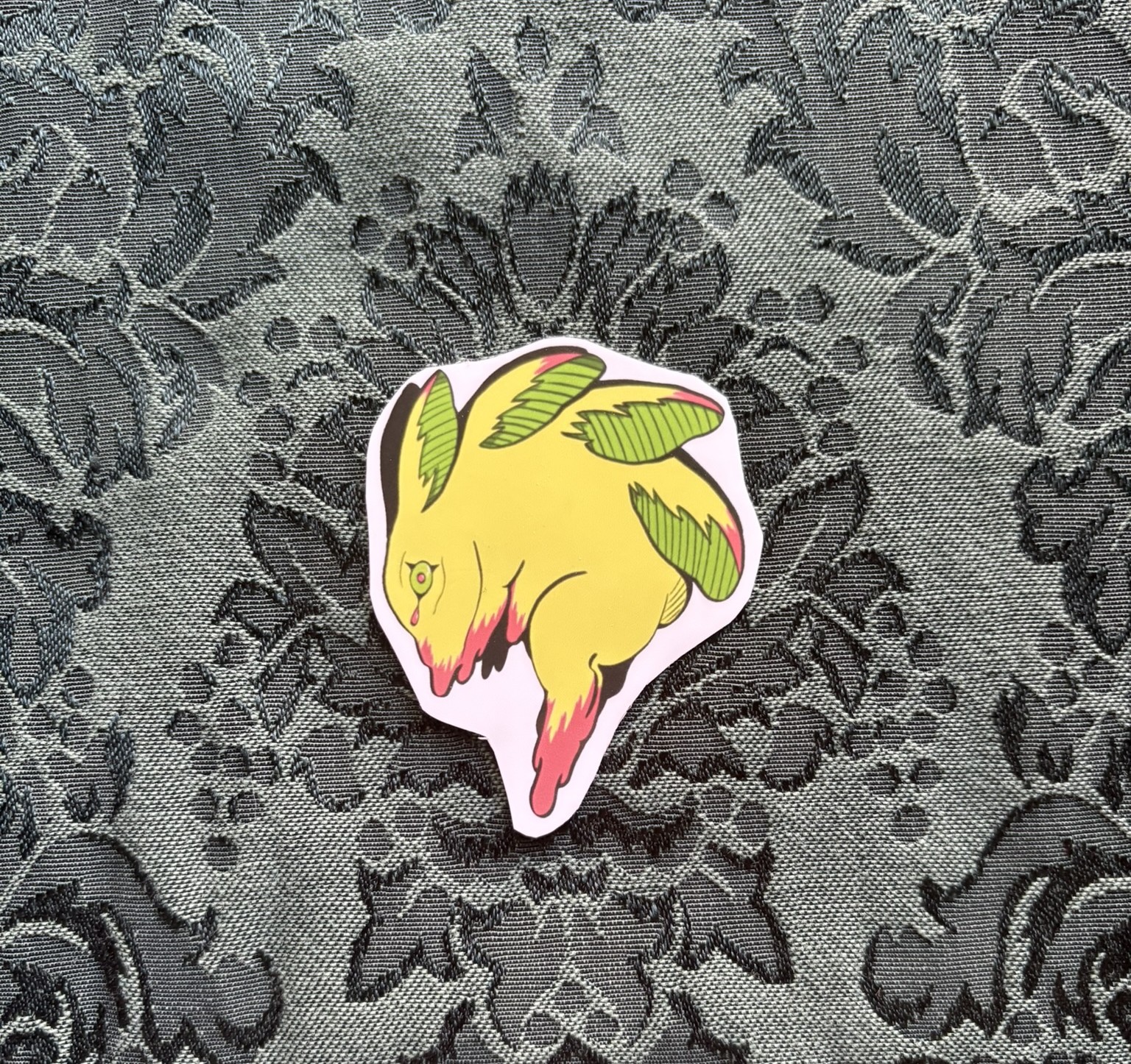 Picture of a melting yellow rabbit with 4 pairs of ears