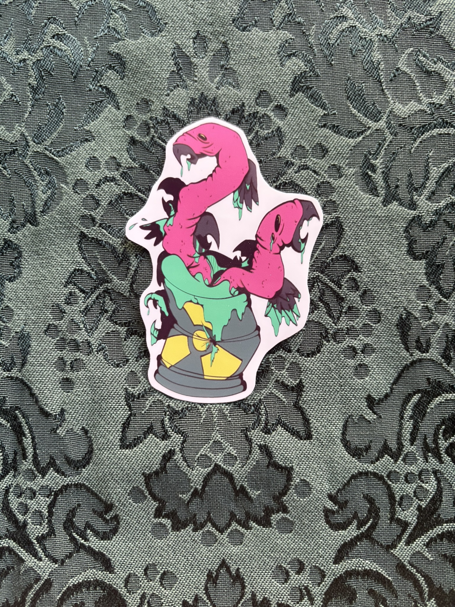 Picture of turkey vultures trapped in a radioactive can. Their bodies are stuck to one another.